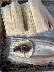 open tamale with spicy venison filling